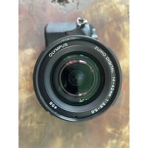 Used/Excellent: Olympus E-410 DSLR 10MP w/ 14-42mm lens. SC:108